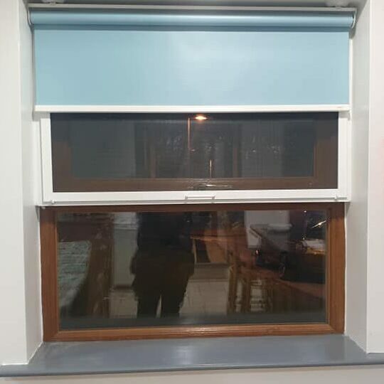 Hinged fly screen fitted to an industrial kitchen
